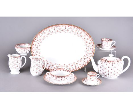 A large Spode Fleur de Lys pattern dinner service in red and gilt with printed factory mark to base, various dates comprising