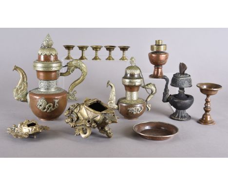 Three Tibetan coffee pots along with eleven burners, three coffee pots one with a feather, a butter lamp and 7 miniature, two