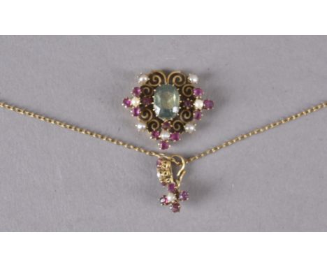 An Edwardian tourmaline, seed pearl and ruby Holbein style pendant, the central green stone surrounded by four cruciform clus