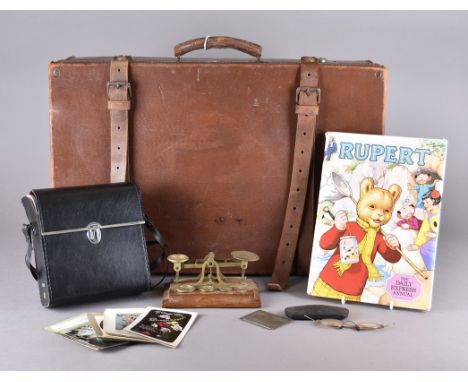 A leather travelling case together with a set of postal scales, a set of travelling scales, a pair of binoculars, a pair of s
