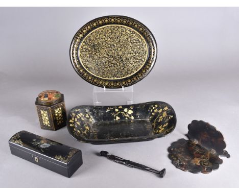 A collection of papier mache items including an oval gilt decorated tray, a mother-of-pearl inlaid glove box, a rectangular d