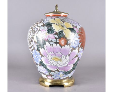 A large Chinese porcelain brass mounted table lamp decorated with pink and coloured flowers against a gilt ground, 44 cm high