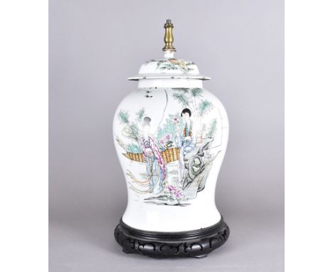 An mid 20th Century Chinese porcelain lamp base, baluster form on pierced hardwood base, decorated with two women in a garden