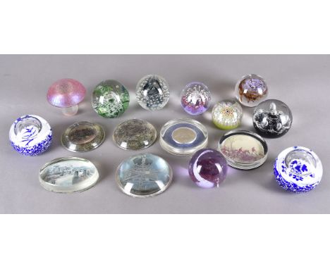 A large collection of glass paperweights, including four millefiori examples, three iridescent, various Caithness limited edi