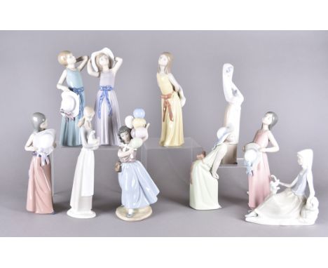 A collection of Lladro and Nao figurines, all females and girls, including a set of six Lladro girls with sunhatsOverall in g