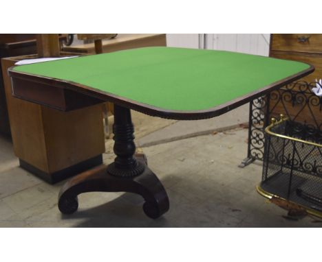 A rosewood card table, fold over top revealing green baize playing surface, swivels to reveal interior recess, turned pedesta