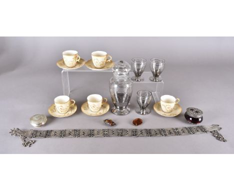 A part Worcester blush ivory coffee set together with a part art deco glass liquor set, a North African silver plated belt, a