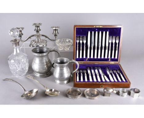 A three piece silver plated tea set, a part cased set of mother of pearl and silver plated fruit knives and forks, a quantity