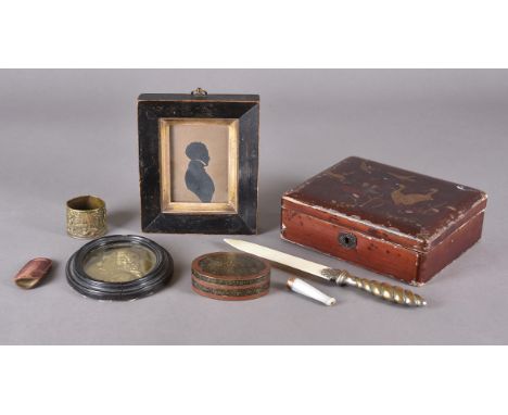 A collection of works of art including a 19th Century silhouette, a 19th Century brass embossed oval portrait of a cardinal, 