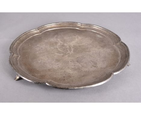 A George VI silver salver of circular ogee form supported on three scroll bracket feet, Sheffield 1925, 20 ozt