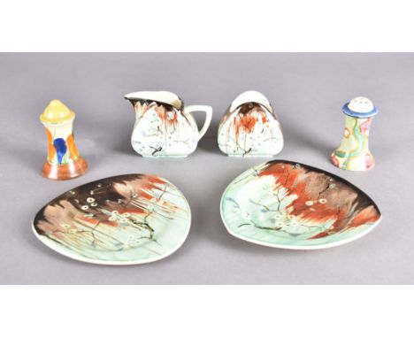 A collection of Clarice Cliff pottery, including an Autumn crocus salt, a floral pepper, a matched pair of triangular saucers