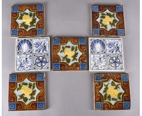 A pair of Maw &amp; Co pottery tiles, blue and white decoration of seaweed and shells, together with five tubeline decorated 