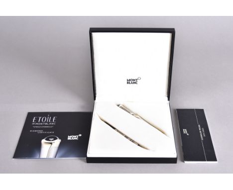 A Mont Blanc silver Etoile ball point pen, with engine turned body and cap, diamond set top under cabouchon glass, marked to 