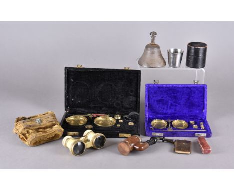 A pair of 1900's J H Steward ivory opera glasses together with two cased sets of travelling scales, an amber cheroot holder, 