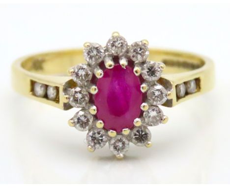 An 18ct gold diamond & ruby ring, approx. 0.28ct of diamond, ruby 6mm x 5mm, 3.2g, size O