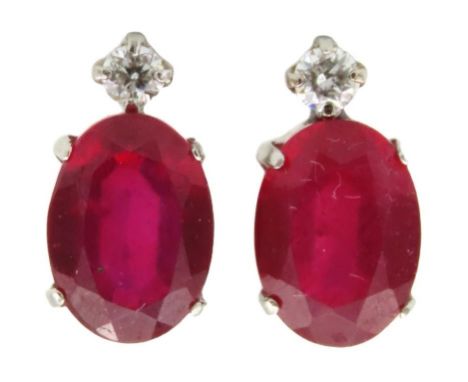 A pair of art deco style platinum set ruby & diamond earrings with post setting, 0.06ct diamonds, 9mm high x 5mm wide, 1g exc