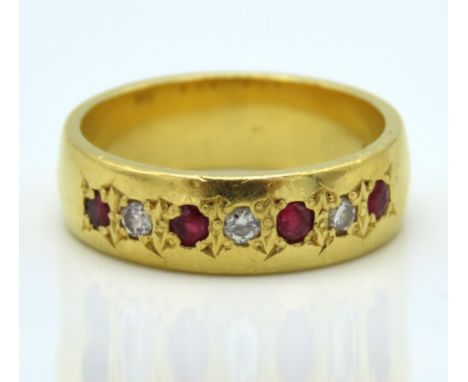 A 22ct gold band set with ruby & diamond of approx. 0.12ct, size Q, 9.7g