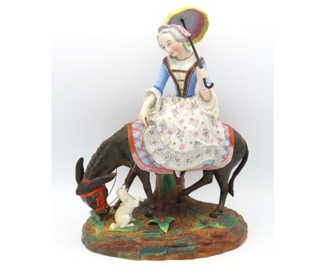 A continental porcelain bisque & part glazed figure of woman, donkey & dog on naturalistic plinth, fault to restored arm, 312