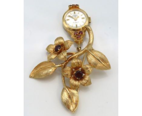 A 9ct gold brooch of organic form set with 21 jewel Rotary fob watch & garnet, 61mm x 45mm, 14.7g