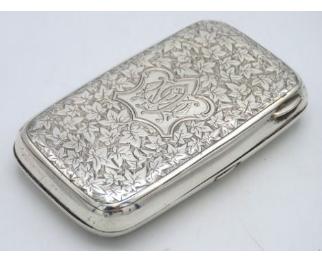 A Victorian 1882 Birmingham silver cigarette case by George Unite with chased leaf decor, monogrammed, 63.3g