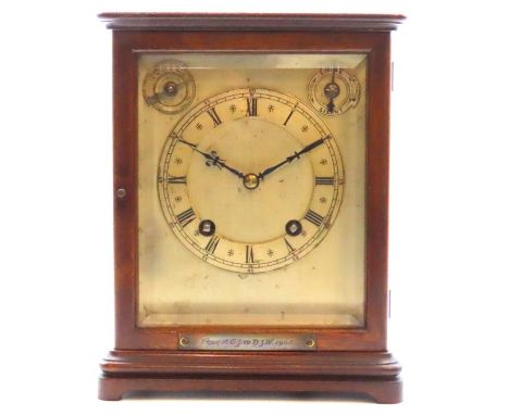 An Edwardian oak cased Winterhalder & Hofmeier bracket clock with glazed panels & silvered dial, chimes once on the quarter, 