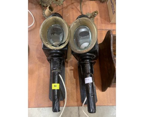 A pair of carriage lamps with wall brackets. Converted for electric light