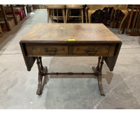 A small mahogany sofa table