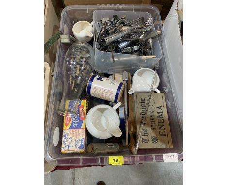 Two boxes of vintage medical equipment and a bed rest support