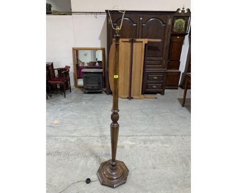 A 1920s oak lamp standard