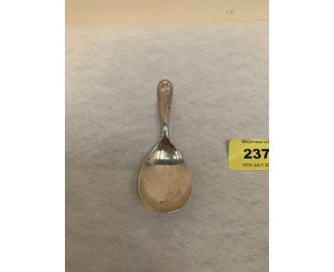An Elizabeth II silver caddy spoon. London 1979