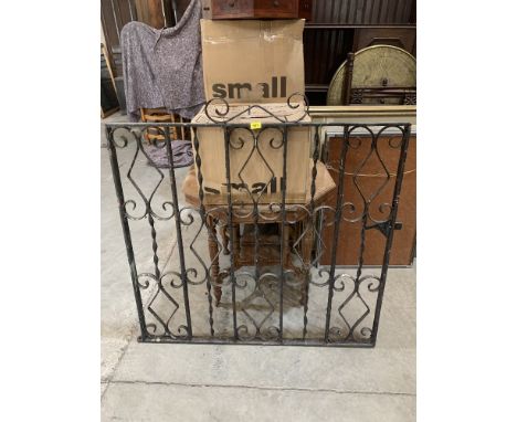 A wrought iron gate. 45½' h x 44' w