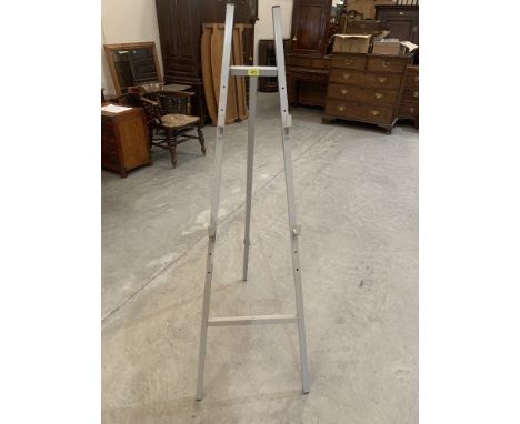 A metal picture display easel. 62' high