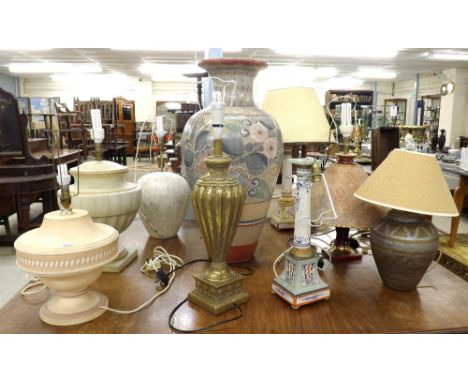 Large collection of various pottery and ceramic table lamps of various forms; together with a baluster giltwood table lamp an