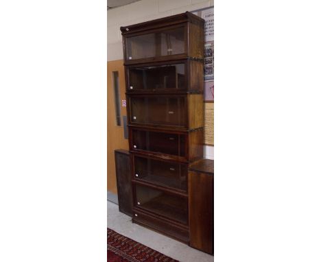 Globe Wernicke six tier sectional glass fronted bookcase fitted with matched sections with top and base, 90" high