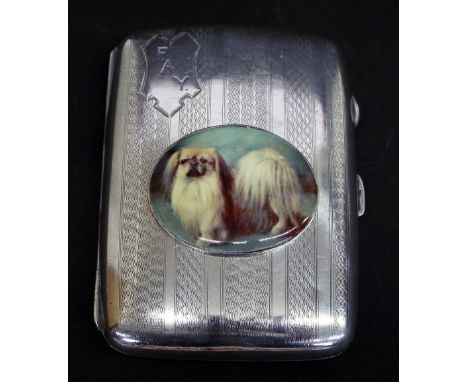 1920s silver hip shaped engine turned card case, inscribed 'F.A.Y' and applied with a later oval enamel of a Shih Tzu, 3.5" l