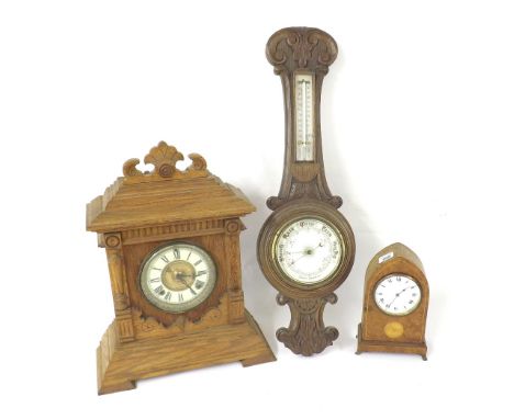 Burr walnut lancet mantel clock, inlaid with a conch shell, 9" high; together with a German two train mantel clock, 18" high 