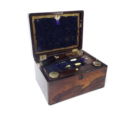 19th century rosewood jewellery casket, the hinged lid enclosing a fitted interior with various glass bottles and tools etc, 