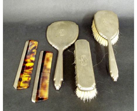 1950s four piece silver engine turned dressing set to include two brushes, comb and mirror, maker D & F, the mirror 10.25" lo