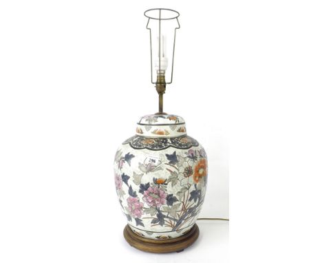 Chinese porcelain table lamp in the form of a lidded ginger jar enamelled with lotus flower and butterflies, the jar 17" high