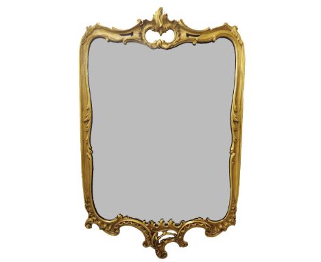 Giltwood wall mirror in the rococo manner with various scrolls and shells, 38" high x 25" wide