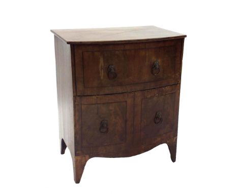 19th century flame mahogany bow fronted commode cabinet with lion head ring handles, 28" high x 24" wide (a.f)