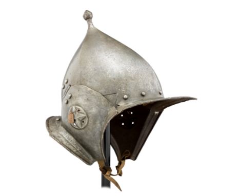 A SOUTH GERMAN BURGONET, CIRCA 1560-70 with pointed one-piece skull boxed in four panels, rising to a prominent baluster-shap