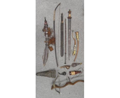 TWO AFRICAN SWORDS, A SCABBARD FOR THREE SUDANESE DAGGERS, AN AFRICAN QUIVER, A BOW, AN AFRICAN CROSSBOW, TWO SOUTHEAST ASIAN