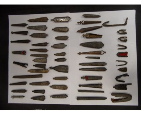 A LARGE COLLECTION OF IRON SCABBARD CHAPES, MEDIEVAL, STUART, AND TUDOR with a number of lead-alloy examples, contained in fi