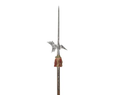 A HALBERD, LAST QUARTER OF THE 16TH CENTURY, GERMAN OR STYRIAN with long terminal spike of diamond-section, curved axe-blade 