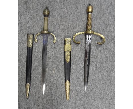 TWO LEFT-HAND DAGGERS IN LATE 16TH/EARLY 17TH CENTURY STYLE, SPAIN, 20TH CENTURY the first with pierced broad double-edged bl