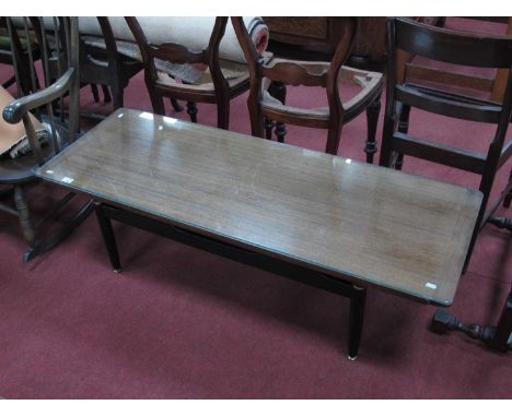 Vintage E.Gomme Plan Rectangular Shaped Coffee Table, with a glass op, on ebonised supports, 137cm wide.