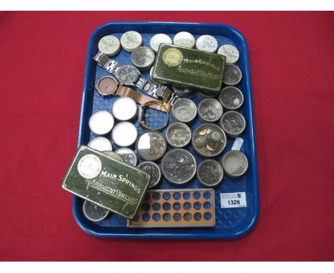 A large quantity of vintage watchmaker's storage tins of various sizes and contents. One tray
