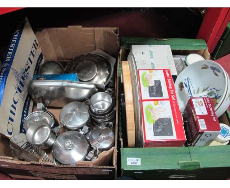 A quantity of stainless steel ware to include teapot, jugs, toast rack, bowls, napkin rings, and quantity of cutlery, togethe