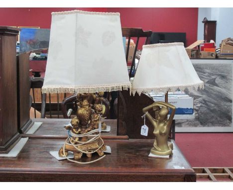 Gilded Table Lamp, with winged cherubs, together with one other, table lamp of an African Girl.